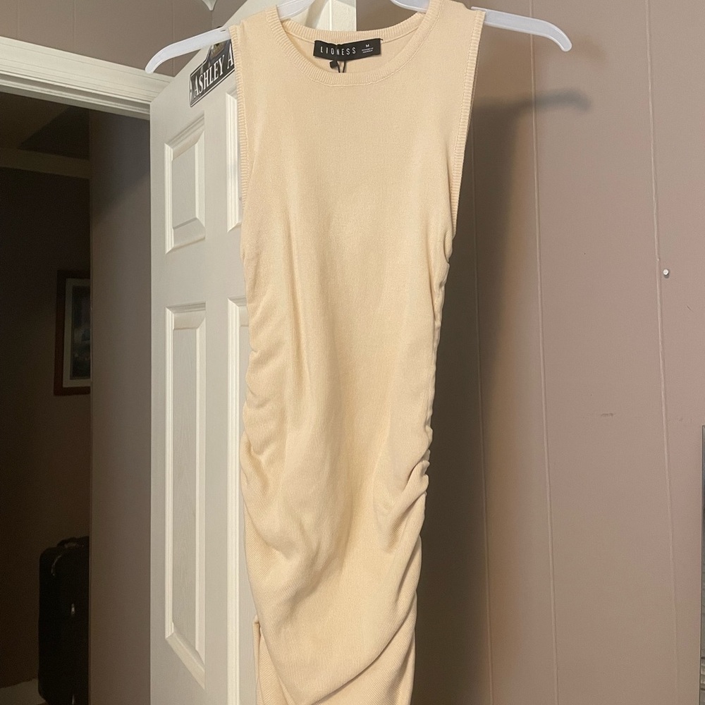 Princess Polly dress. Size Medium. light tan. Adjustable strings on sides.